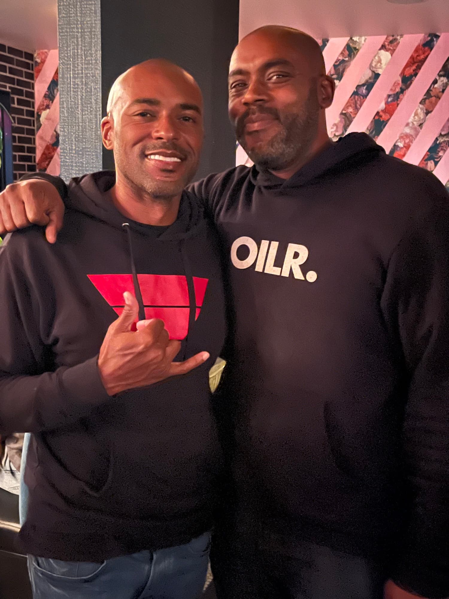 Two men standing together in Brotherhood